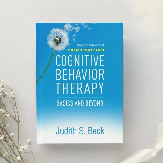 Angled view of the Cognitive Behavior Therapy: Basics and Beyond third edition book.