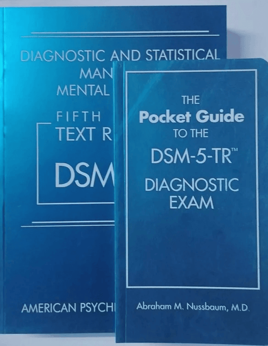 Two blue books are positioned side-by-side, with the larger Diagnostic and Statistical Manual of Mental Disorders Fifth Text Revision behind the smaller Pocket Guide to the DSM-5-TR Diagnostic Exam.